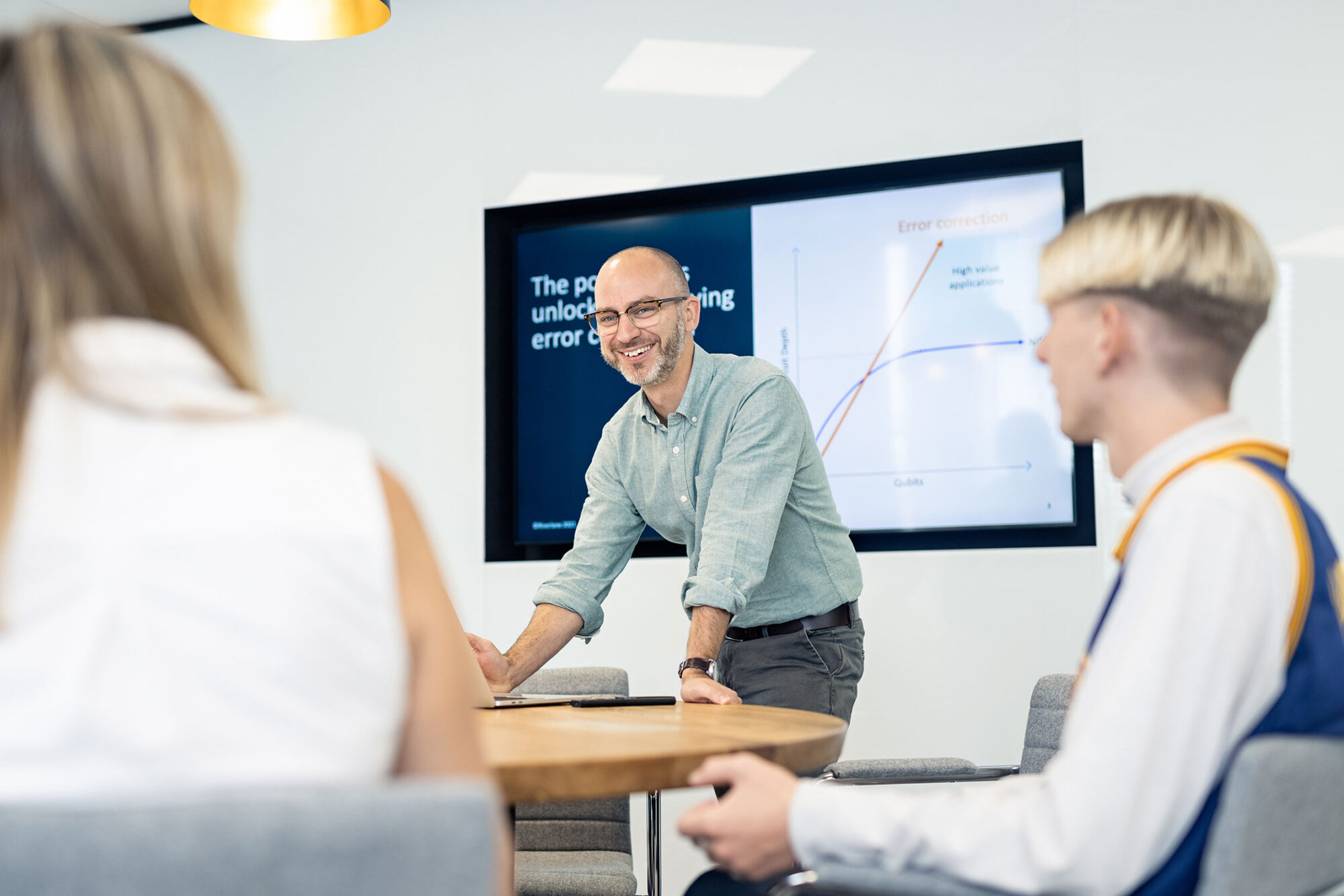 Marketing and office PR photography for Cambridge business Riverlane with CEO Steve Brierley in a meeting.