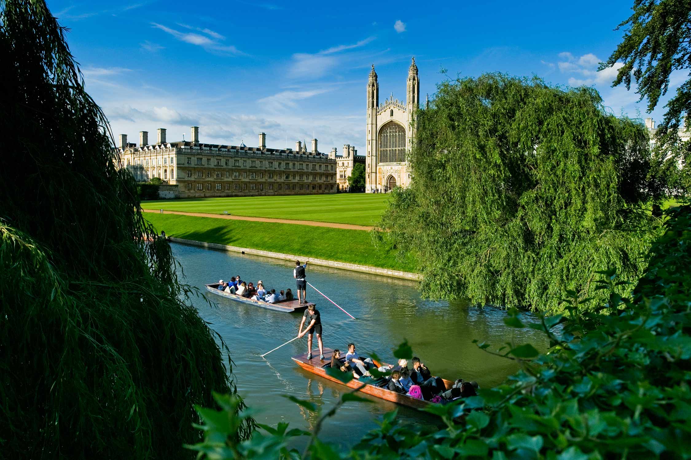 Summer photo of King's college chapel Cambridge, the river cam and punters.