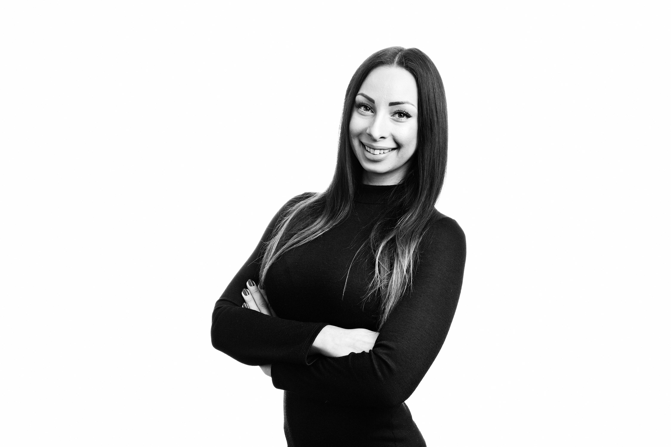 Company staff portrait shot in black and white against a pure white background.