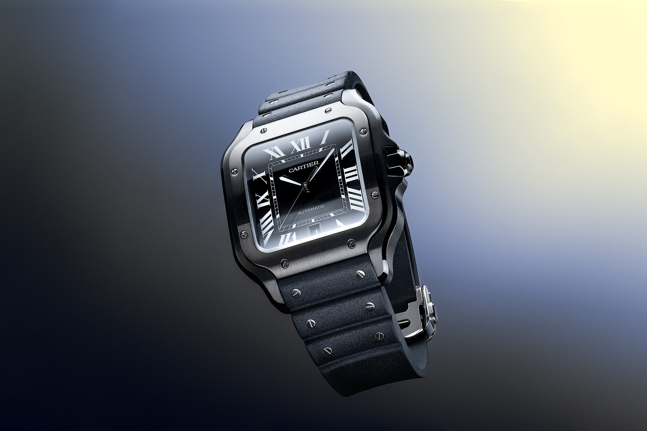 Catalogue advertising watch photography of a Cartier Santos ADLC against a gradient background.