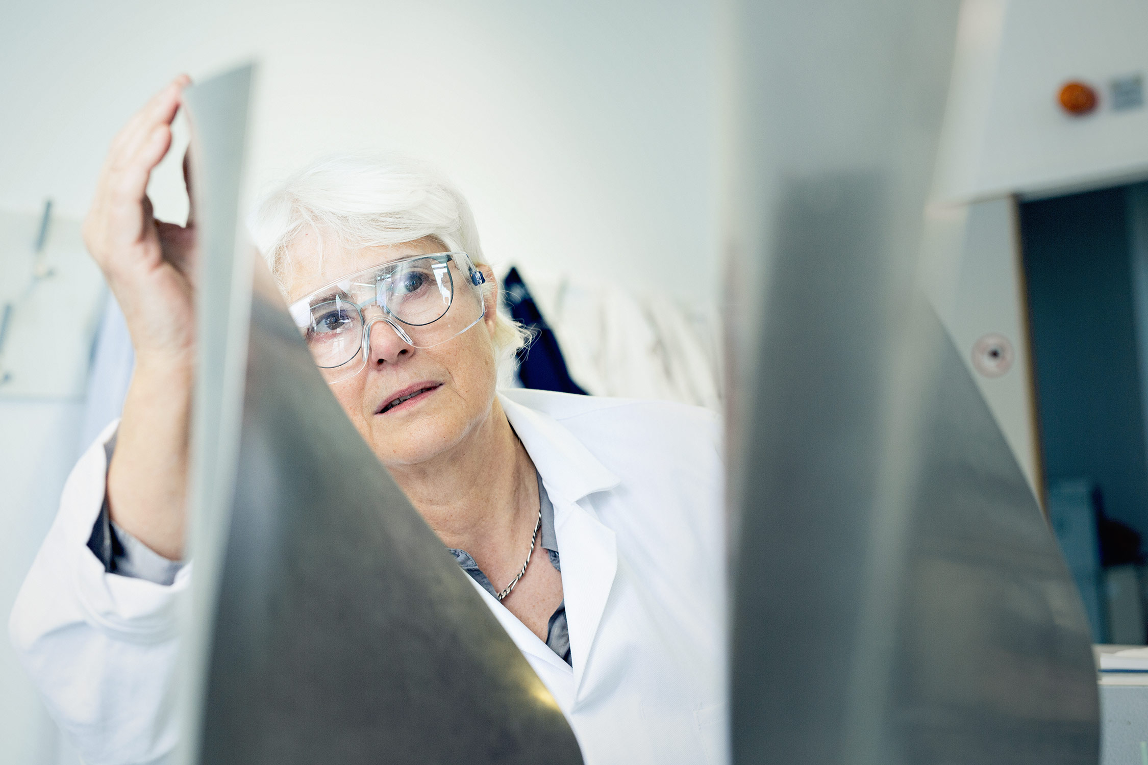 Professional editorial photography of an engineering technician at the University of Cambridge.