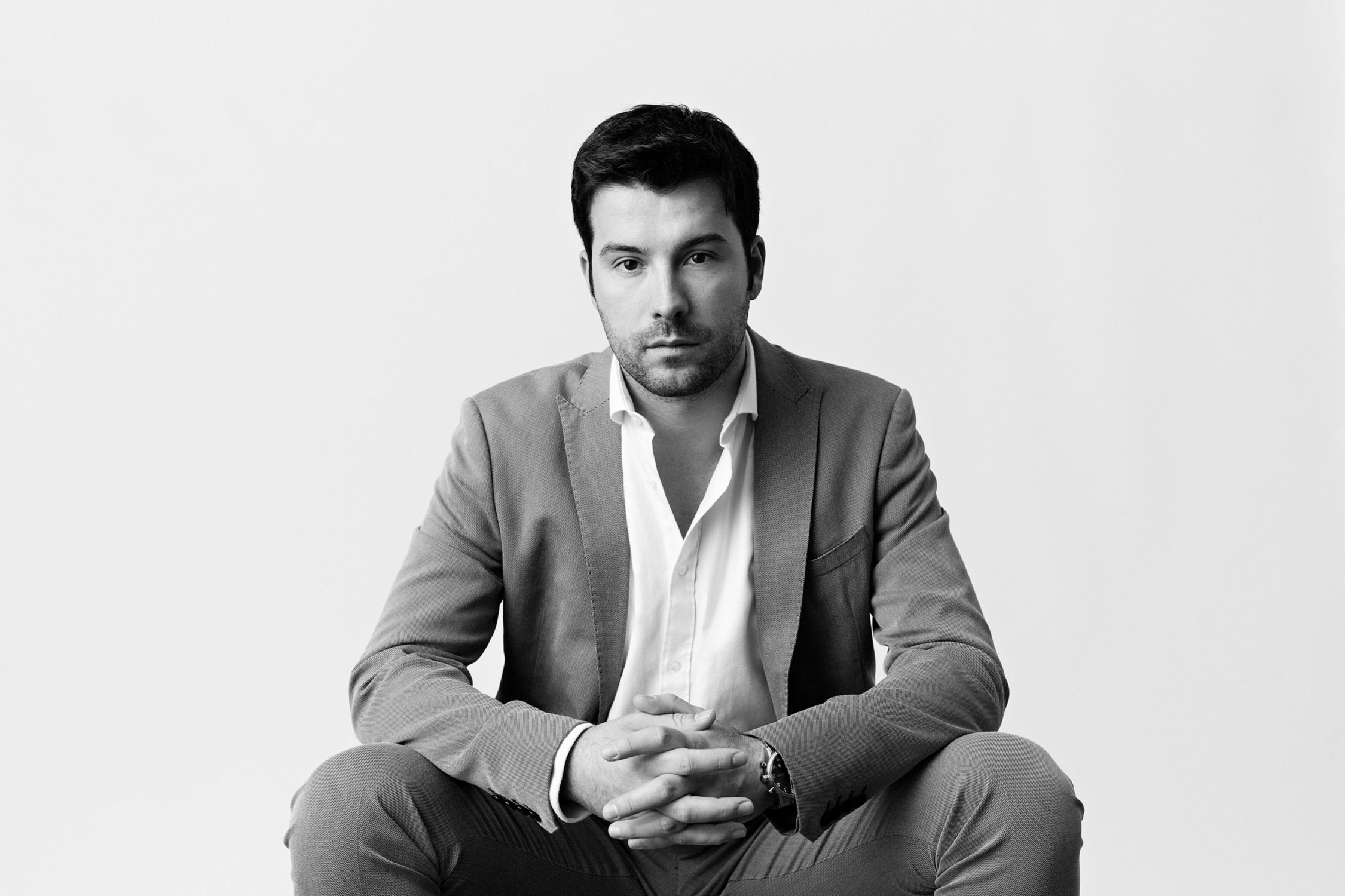 Modern studio portrait photography of a man in black and white.